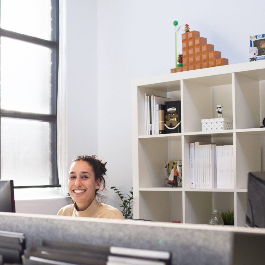 person at desk smiling